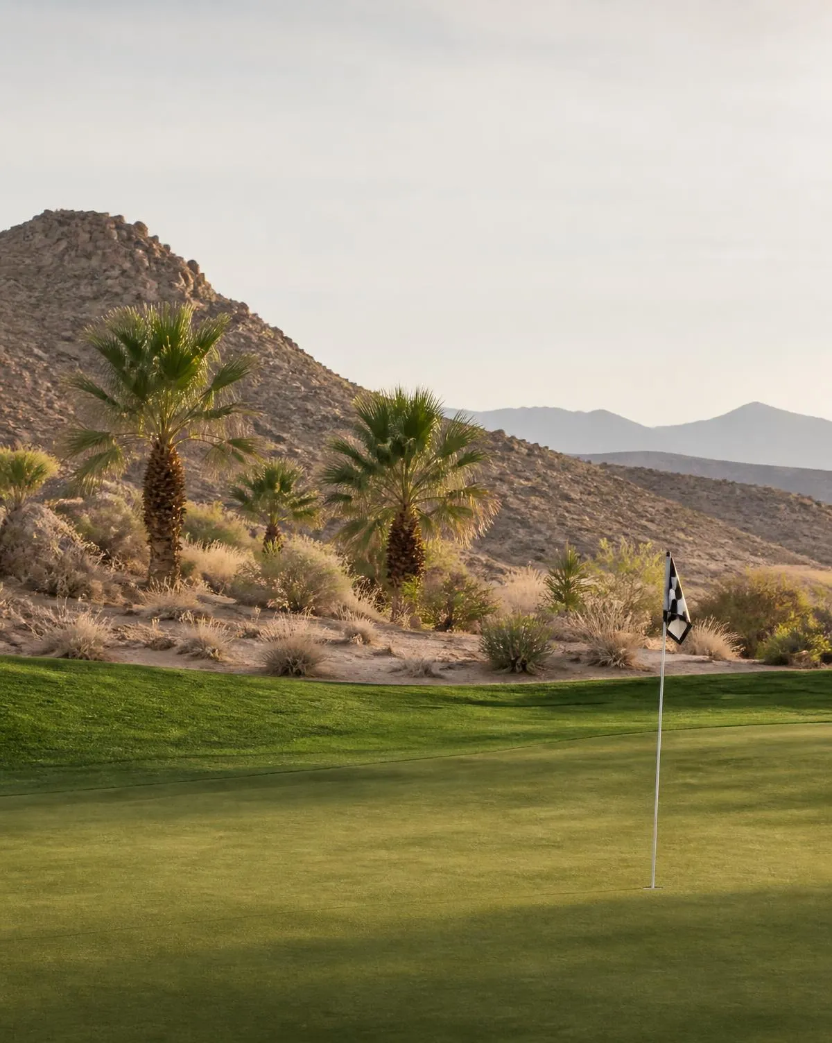 Golf course fairway in the Las Vegas Valley with mountains behind it